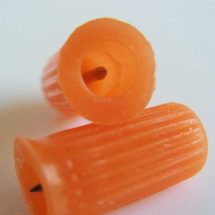 Small plastic cap inserted metal pin