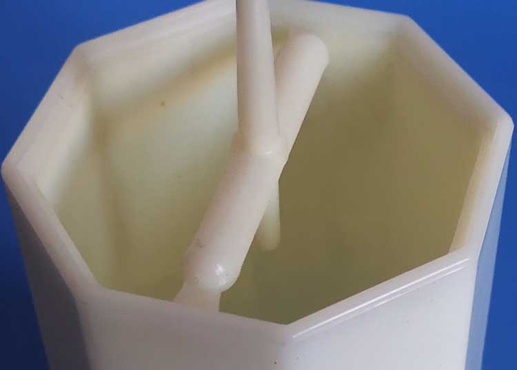 A plastic cylinder container for wall soap dispenser